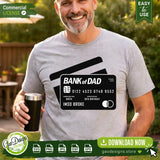 Smiling man wearing a grey t-shirt featuring the funny Bank of Dad SVG credit card design. This lifestyle apparel mockup showcases how the Imso Broke digital cut file looks on physical products, making it the perfect Father's Day shirt idea for Cricut crafters and print-on-demand sellers.
