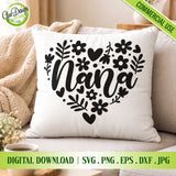 A cozy lifestyle mockup of a white throw pillow featuring the "Nana" floral heart SVG cut file design, styled on a sofa