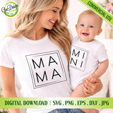 perspective view of a smiling woman holding a baby in a home setting. The woman wears a white T-shirt with the 'MAMA' boxed design and the baby wears a onesie with the 'MINI' boxed design