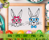 Illustrative flat element view on a white wooden background showing the two separate designs: the black line art female bunny face with a pink polka dot head bow and pink glasses, and the male bunny face with a blue polka dot bowtie and blue glasses