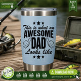Blue insulated tumbler mockup with the 'Awesome Dad' sublimation design placed on a wooden dock with fishing gear, showcasing how the PNG file looks on drinkware for outdoorsy fathers.