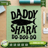 The Daddy Shark SVG cut file shown on a green Cricut cutting mat alongside standard crafting and weeding tools, highlighting how effortless it is for DIY crafters and small business owners to use this design for vinyl projects.