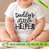 A close-up view of a happy baby wearing a white short-sleeve bodysuit featuring the 'Daddy's Little Helper' text and wrench-shaped letters. The bodysuit is displayed against a cozy, soft blanket background, suitable for a Father's Day or DIY dad's gift. This digital download product includes SVG, PNG, EPS, DXF, and JPG file types with a commercial license for crafters and small business owners creating custom apparel.