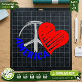 Patriotic America peace heart SVG design displayed on a black Cricut cutting mat with weeding tools, demonstrating a real-life vinyl craft project for patriotic DIY enthusiasts.