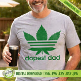 A man smiling while wearing a grey t-shirt featuring the Dopest Dad weed leaf parody design, showcasing a perfect Father's Day gift idea for cool dads who love cannabis culture.