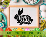 Framed 'Happy Easter' bunny silhouette with Easter eggs and decorations on a table.