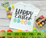 Hanging white t-shirt mockup featuring the colorful "Happy Easter" design with 5 patterned eggs, against a light wall with bird nest and Easter branches decor