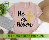 "He is Risen" religious design displayed on a peach-colored t-shirt with aesthetic accessories