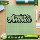 The Made in America digital design file displayed on a green vinyl cutting mat alongside crafting tools, ready to cut for Cricut and Silhouette Independence Day DIY projects.