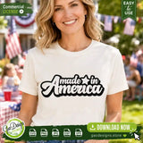 A smiling woman wearing a white t-shirt printed with the black and white wavy typography Made in America SVG design, showcasing a trendy 4th of July shirt project for boutique owners and POD sellers.