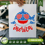 A crafter holding a clear printed transfer film of the round patriotic shark face design over a blank dark grey shirt in a workspace, illustrating heat press and sublimation printing readiness.