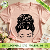 Messy bun mom SVG design printed on pastel t-shirt with floral background